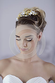 Beauty bride in bridal gown indoors