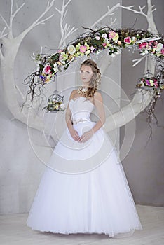 Beauty bride in bridal gown indoors