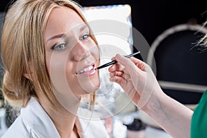 Beauty bride during wedding makeup