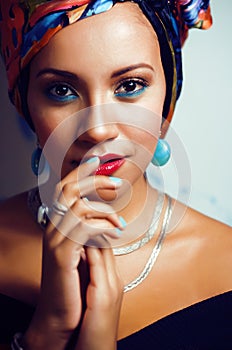 Beauty bright african american woman with creative make up, shawl on head like cubian