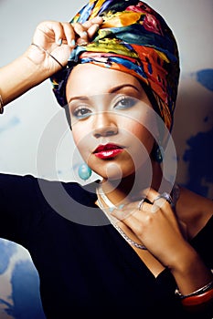 Beauty bright african woman with creative make up, shawl on head