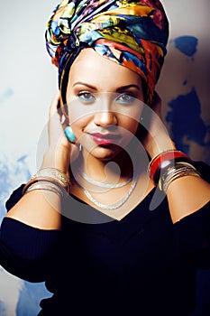 Beauty bright african woman with creative make up, shawl on head