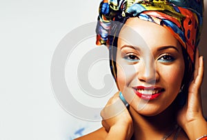 beauty bright african woman with creative make up, shawl on head like cubian closeup smiling