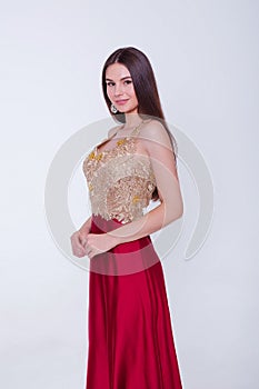 Beauty brunette model woman in evening dress. Beautiful fashion luxury makeup and hairstyle. Seductive girl silhouette