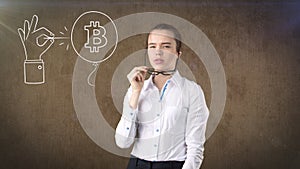 Woman standing near btc logo. Concept of virtual criptocurrency bitcoin dawnfall and correction. photo