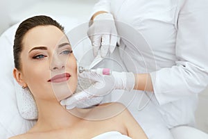 Beauty Clinic. Woman Doing Face Skin Cryo Oxygen Treatment