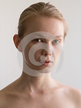 Beauty Close-up face portrait of young woman without make-up. Natural image without retouching , shallow depth of field