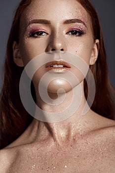 Beauty close up portrait of attractive woman with bright make-up