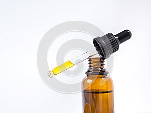 Beauty closeup of bottle with essential oil, serum and dropper