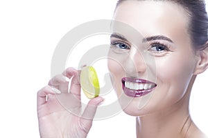 Beauty Closeup Portrait of Cute Winsome  Caucasian Girl Holding Lemon Slice In Front of Her Mouth While Posing Against Pure White