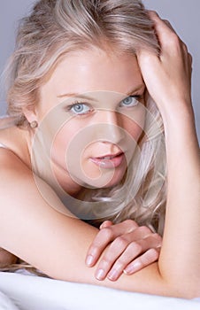 Beauty, closeup and portrait of woman on bed for sensual, makeup and attractive. Relax, cosmetics and glamour with face