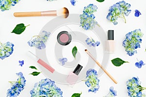 Beauty composition of hydrangea flowers with cosmetics on white background