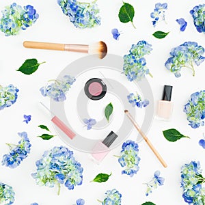 Beauty composition of hydrangea flowers with cosmetics on white background. Flat lay, top view