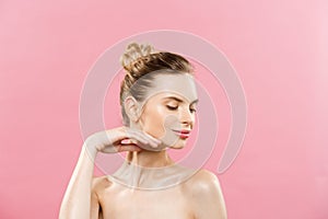 Beauty Concept - Beautiful Caucasian woman with clean skin, natural make-up isolated on bright pink background with copy