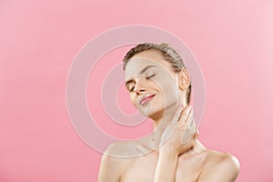Beauty Concept - Beautiful Caucasian woman with clean skin, natural make-up isolated on bright pink background with copy
