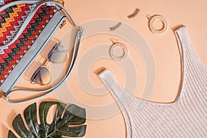 Beauty concept in a blog.Women`s summer accessories, false eyelashes.Female background and fashion. Exotic green leaf of