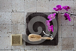 Beauty concept with loofah body brush on limestone for exfoliation