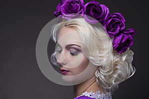 Beauty Concepts. Portrait of Blond Caucasian Female With Purple Flowery Crown