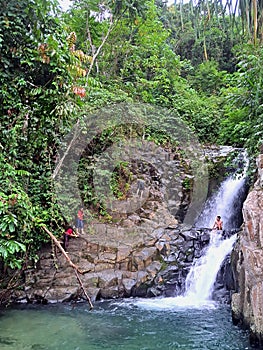 The beauty and coolness of the waterfall in the middle of the forest