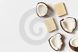 Beauty and cosmetic concept with soap bar and coconut on white background