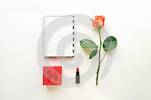 Beauty cosmetic white background with red lipstick, gift box and roses