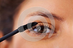 Beauty, cosmetics and eye lash curling makeup on woman face portrait, getting ready and grooming in the morning. Closeup