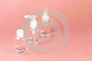 Beauty cosmetics glassbottle; branding mock up; front view on pastel pink background.