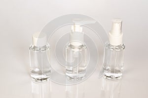 Beauty cosmetics glassbottle; branding mock up; front view on pastel white background.