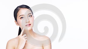 Beauty, cosmetics, healthy, treatment, skincare and spa concept. Asian young woman touching own face with clear fresh skin.