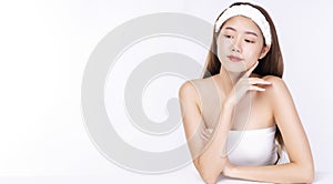 Beauty, cosmetics, healthy, treatment, skincare and spa concept. Asian young woman touching own face with clear fresh skin.