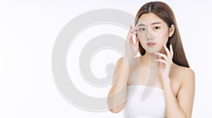 Beauty, cosmetics, healthy, treatment, skincare and spa concept. Asian young woman touching own face with clear fresh skin.