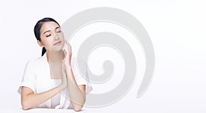 Beauty, cosmetics, healthy, treatment, skincare and spa concept. Asian young woman touching own face with clear fresh skin.