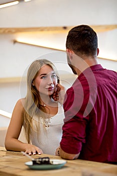 Beauty couple having fun at cafe