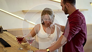 Beauty couple having fun at the cafe with cocktails