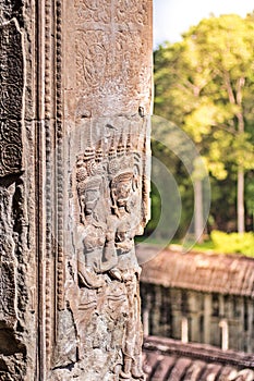 Beauty Dancing Apsaras an old Khmer art sand stone carving of Apsara status on the wall at world heritage, Siem Reap, Cambodia