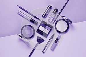 Beauty, decorative cosmetics. Ultraviolet Makeup brushes set and color eyeshadow palette , flat lay, top view, Minimalistic style.