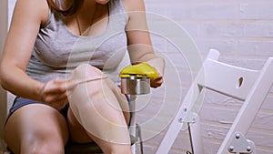 Beauty, depilation, hair removal, hair removal beautiful woman with applicator, applying depilation wax on her leg