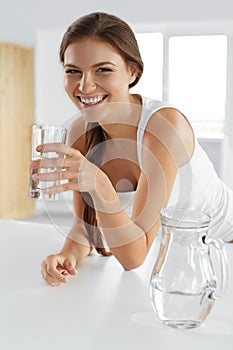 Beauty, Diet Concept. Happy Smiling Woman Drinking Water. Health