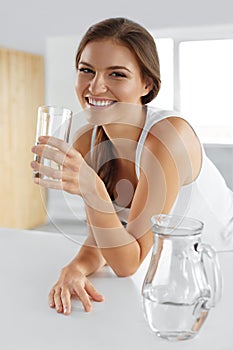 Beauty, Diet Concept. Happy Smiling Woman Drinking Water. Health