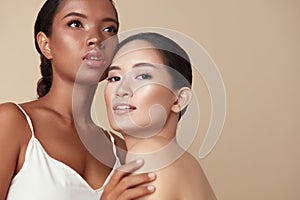 Beauty. Diverse Models Portrait With Copy Space For Advertising. Tender Asian And Mixed Race Women Posing Together.