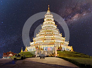 The beauty of the Emerald Buddha Temple at Milky way galaxy with