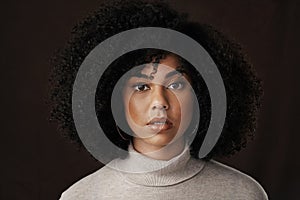 Beauty is in the eye of the beholder. Cropped portrait of an attractive young woman posing in studio against a dark