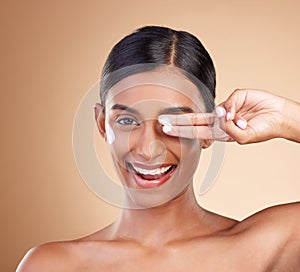 Beauty, face cream and portrait of a woman in studio for skincare, dermatology and cosmetics. Happy Indian female model