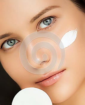 Beauty, face cream and skincare cosmetics model portrait, woman applying moisturiser, cleanser or make-up remover