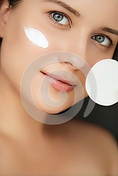 Beauty, face cream and skincare cosmetics model portrait, woman applying moisturiser, cleanser or make-up remover