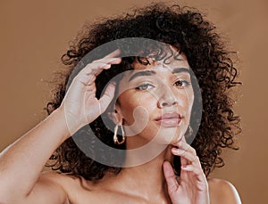 Beauty, face and hands with woman in skincare portrait, curly hair and healthy skin against studio background. Natural