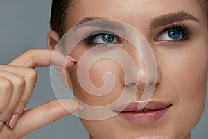 Beauty face makeup. Woman with beautiful eyes and eyebrows