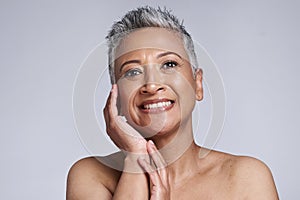 Beauty, face portrait and mature woman, skincare and dermatology of anti aging cosmetics on grey studio background