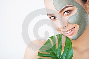 Beauty face skin care. Woman with cosmetic spa facial mask