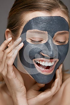 Beauty face skin care. Woman with cosmetic spa facial mask